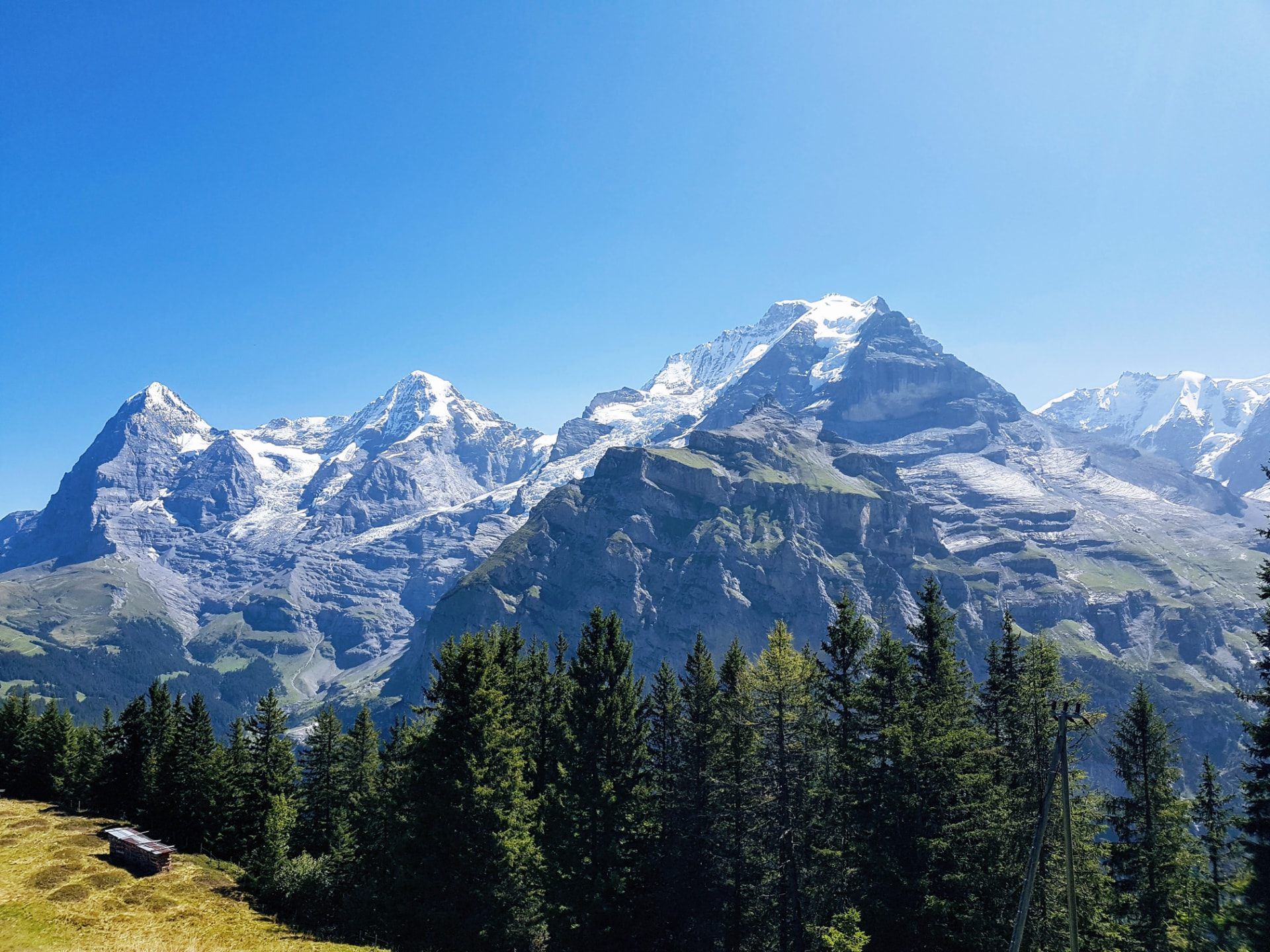 Snow-covered mountain peaks under a blue sky