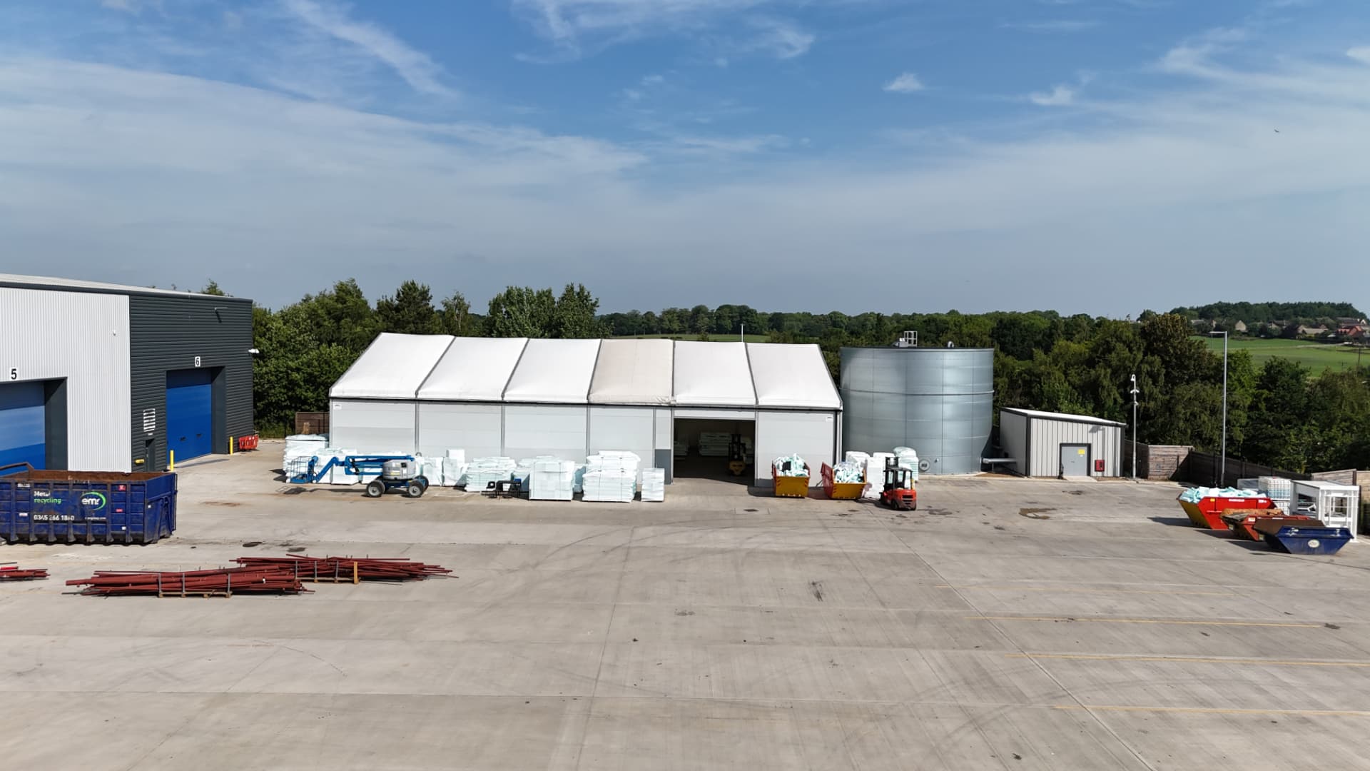 Aerial view of an industrial yard and warehouse buildings